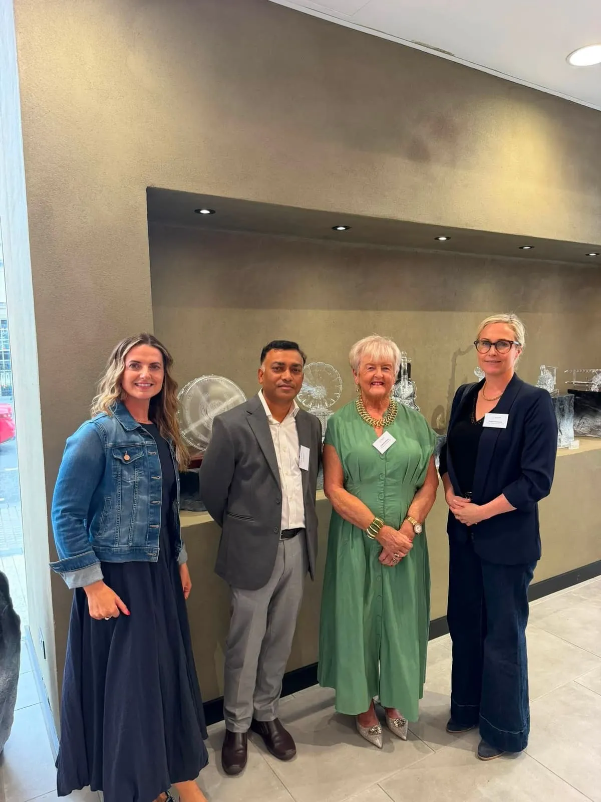 Four members at a Chamber networking event