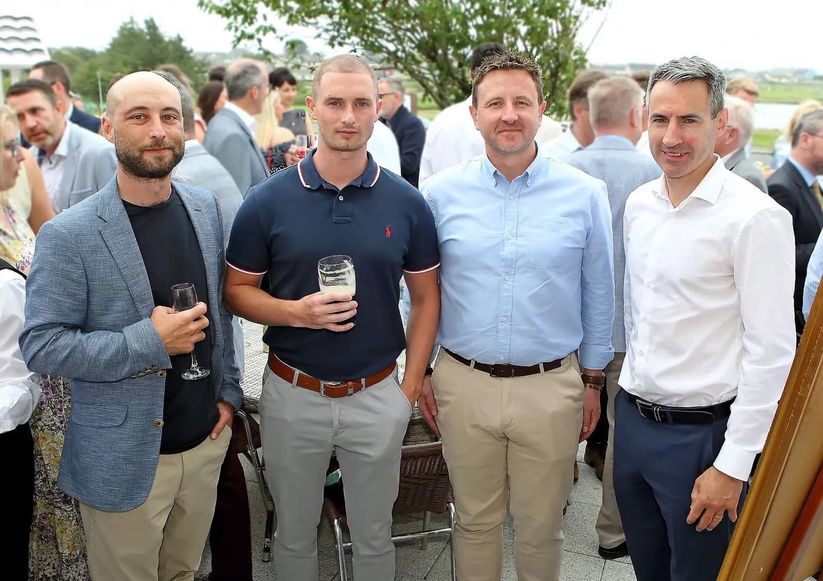 Members with drinks at an outdoor Chamber event